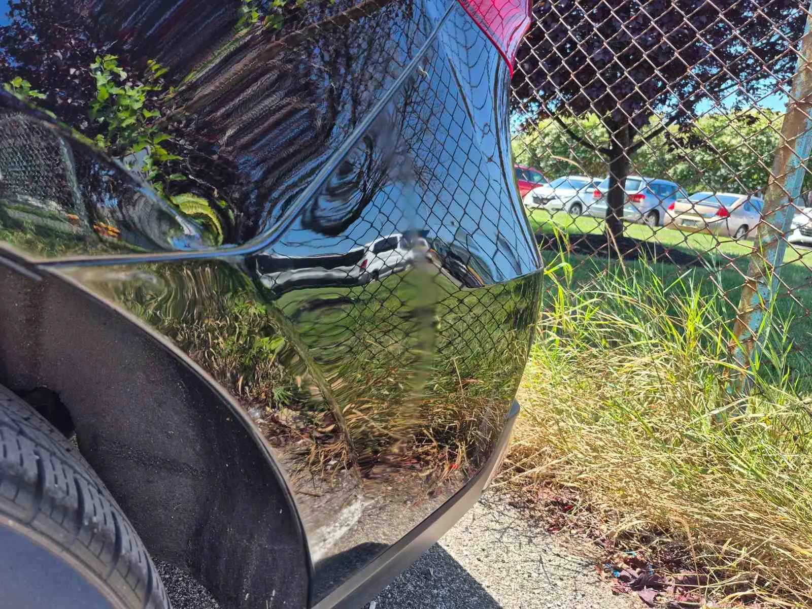 Restored gloss on black rear bumper