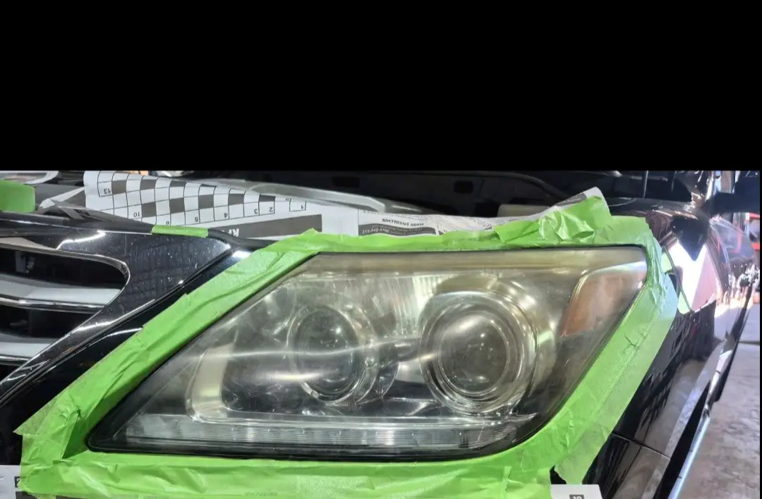 Cloudy Lexus headlight before restoration