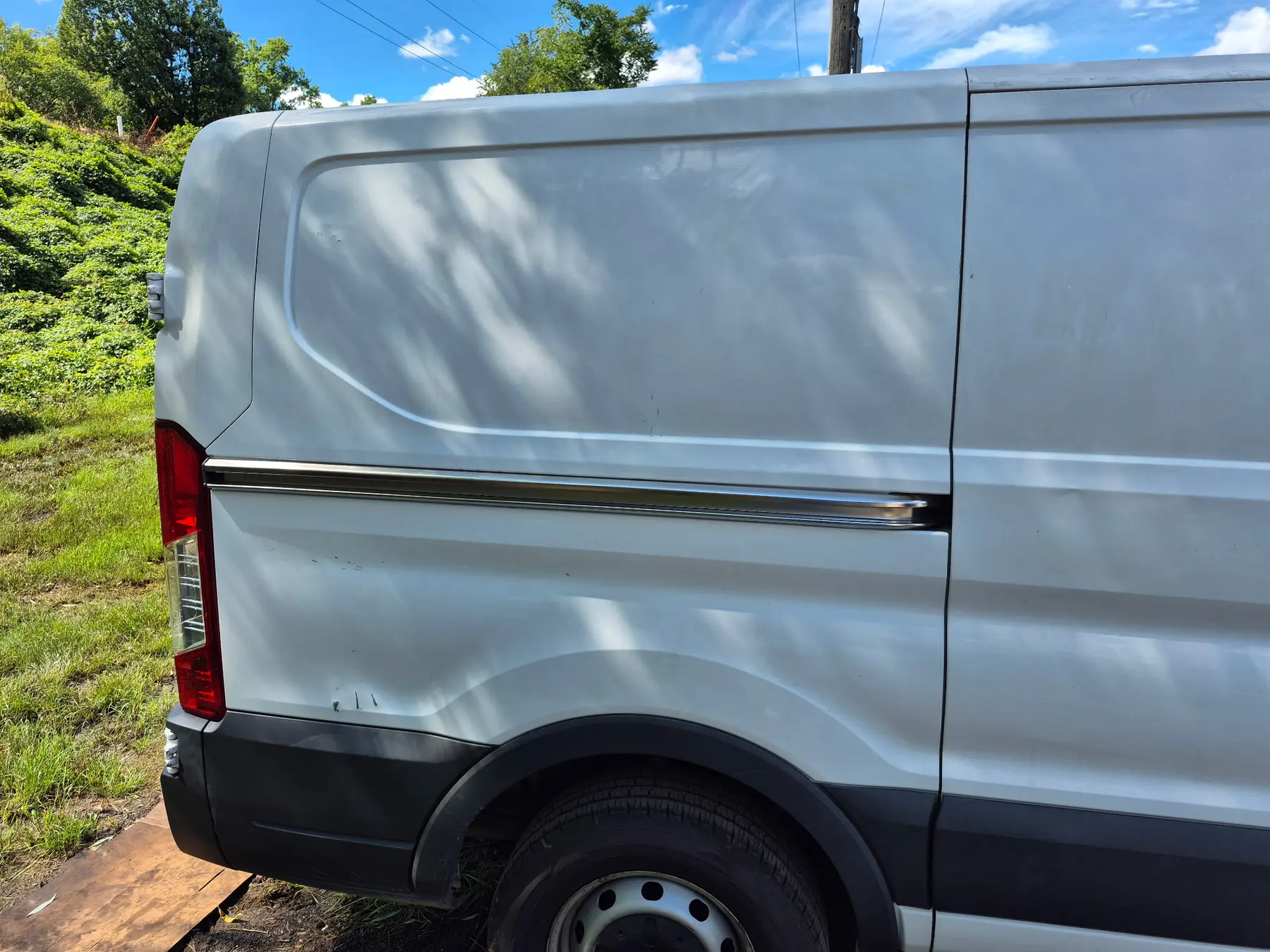 White cargo van panel after correction